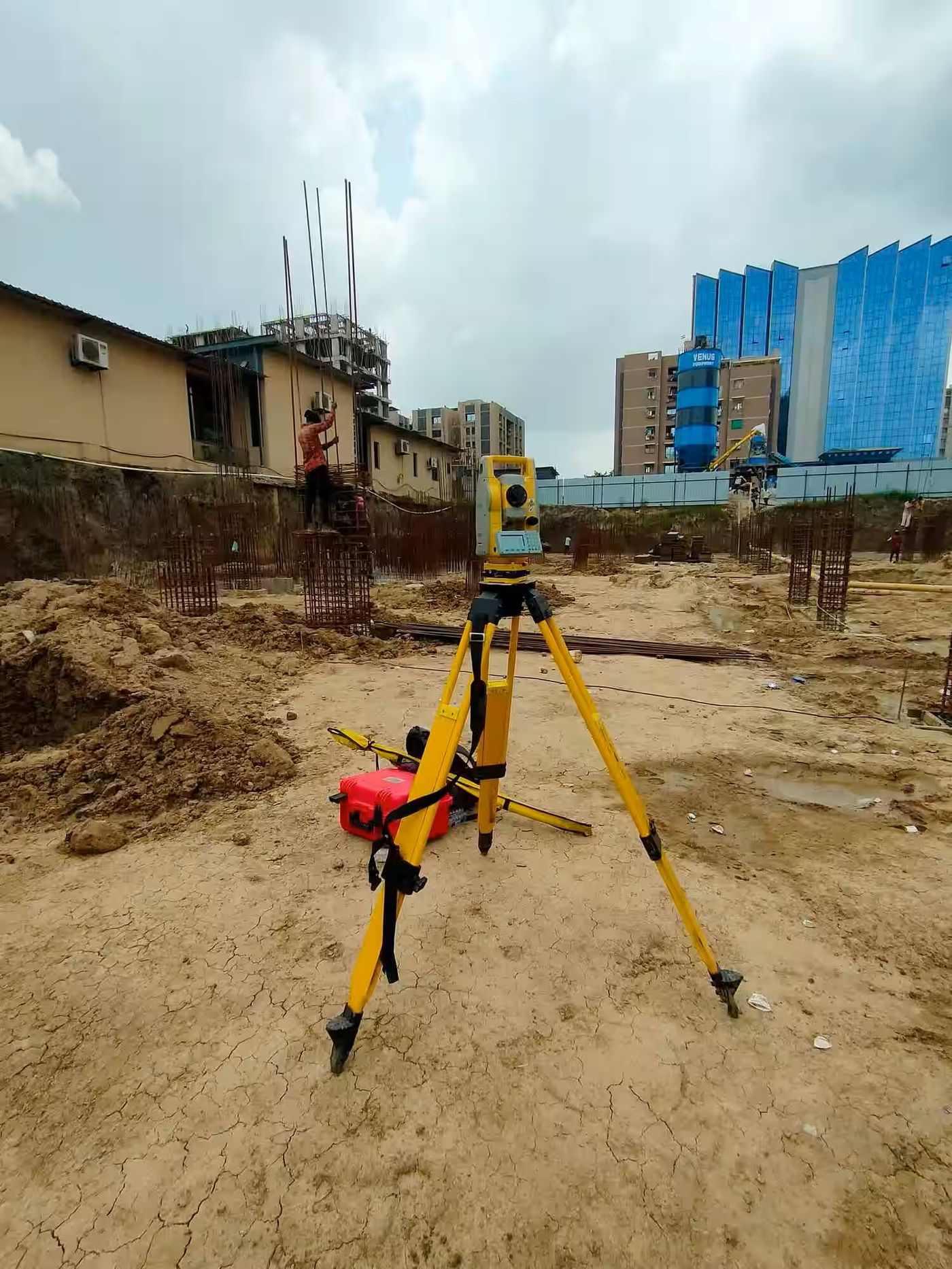 Total station set up on an active construction site
